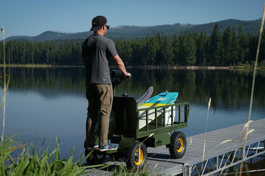 StepRanger All-Terrain electric micro-truck hauling a load on a waterfront dock